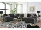 Gray sectional sofa in a living room with decorative elements.