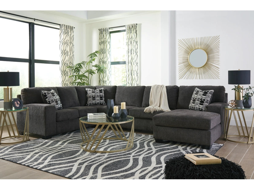 Gray sectional sofa in a living room with decorative elements.